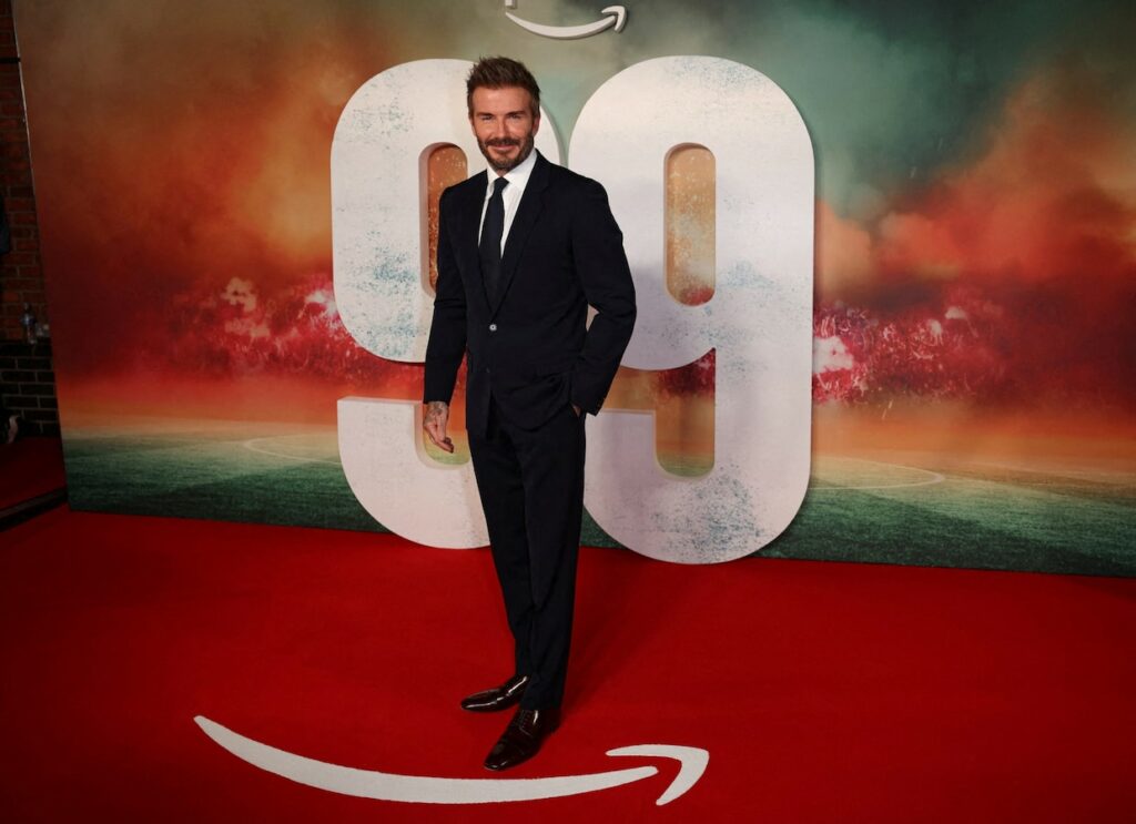 Beckham, Manchester United legends arrive in style for ’99’ premiere