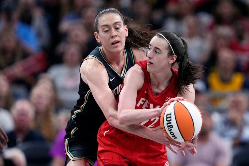 Caitlin Clark rallies the Indiana Fever past the New York Liberty 83-78 with the first triple-double by a WNBA rookie