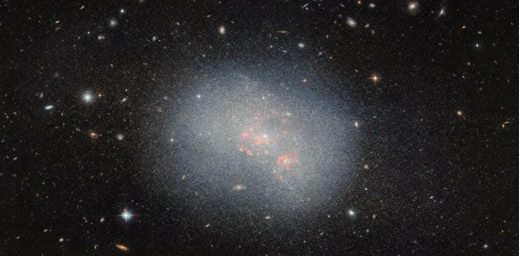 Assembling the Cosmos: Hubble Reveals How Dwarf Galaxies Shape the Largest Galaxies