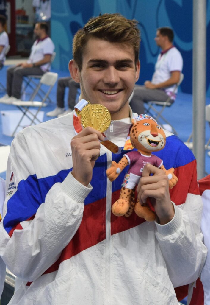 World Championships, Day Eight Finals: Kliment Kolesnikov Blazes to Title in 50 Backstroke; Tie for Silver – Swimming World